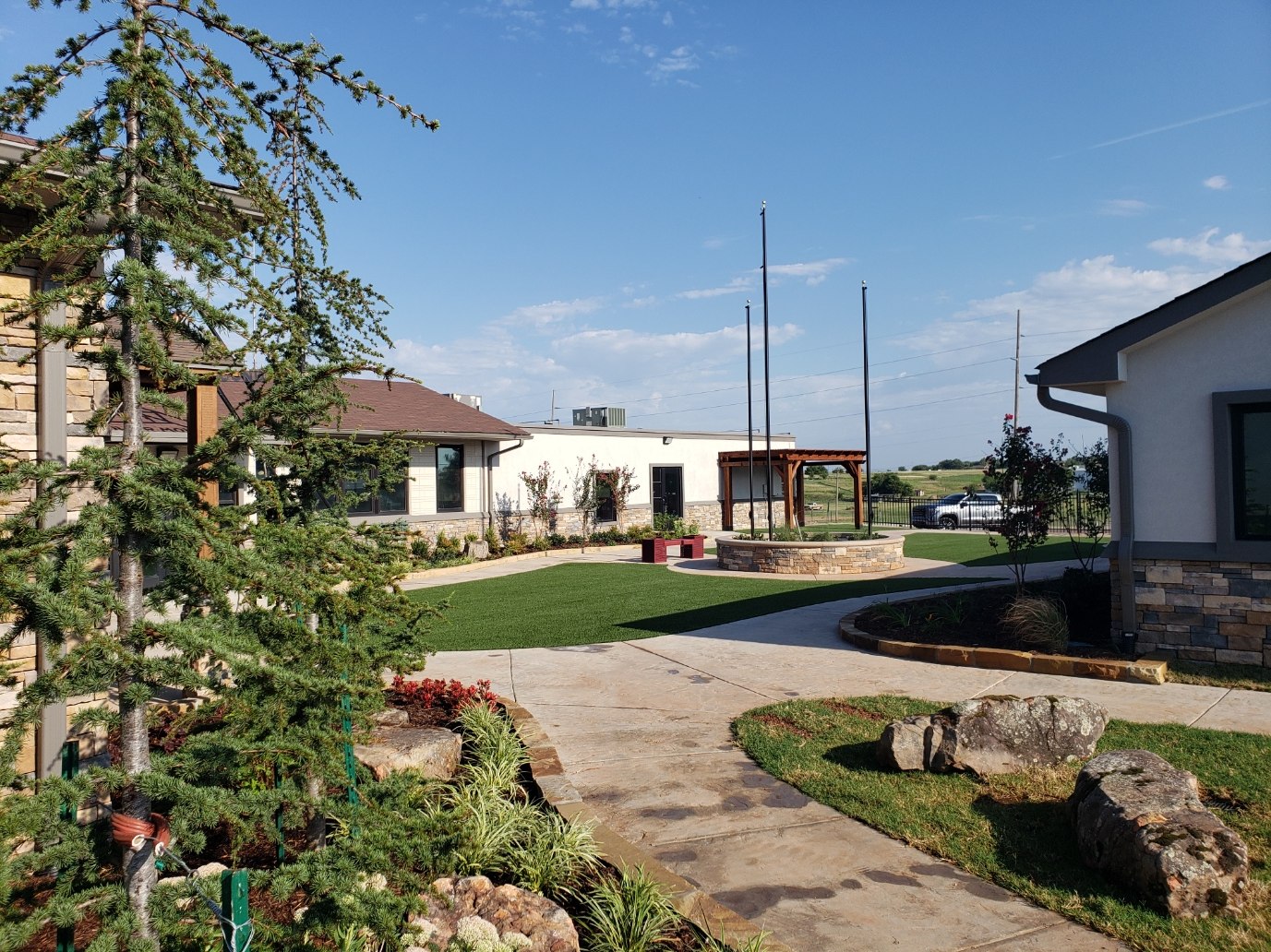 Entry courtyard with natural stone landscaping in Southwest Oklahoma